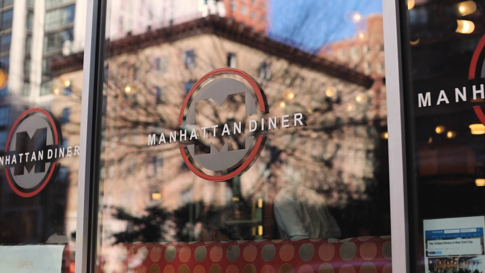 Manhattan Diner logos on the restaurant windows.
