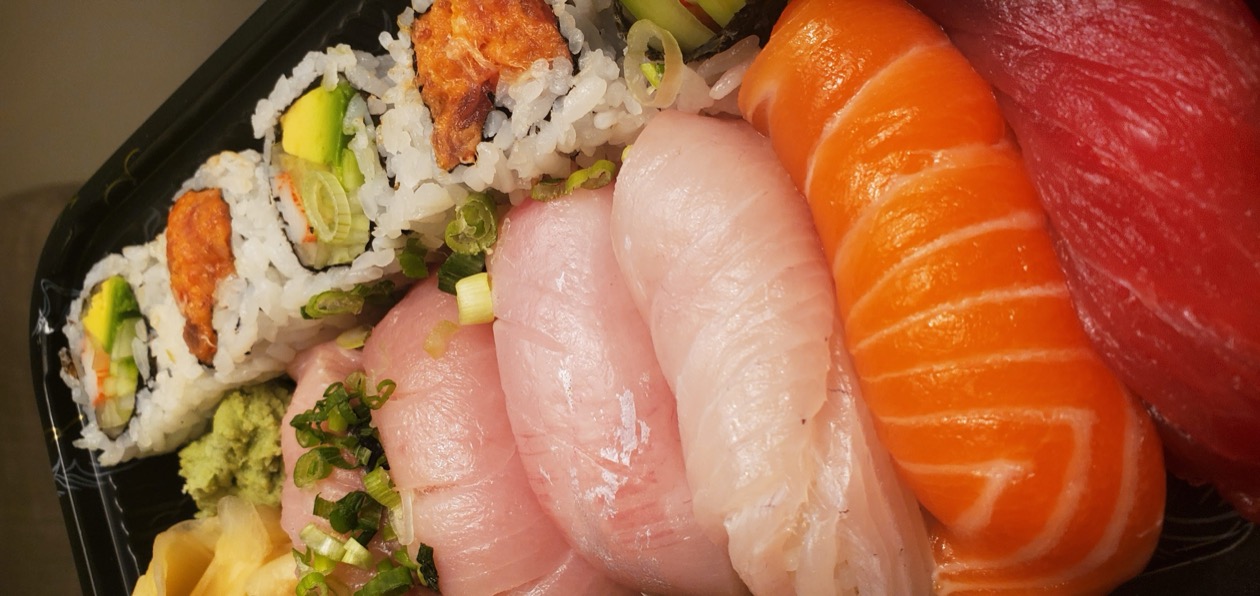 Omakase nigiri lineup with white fish, salmon, and tuna
