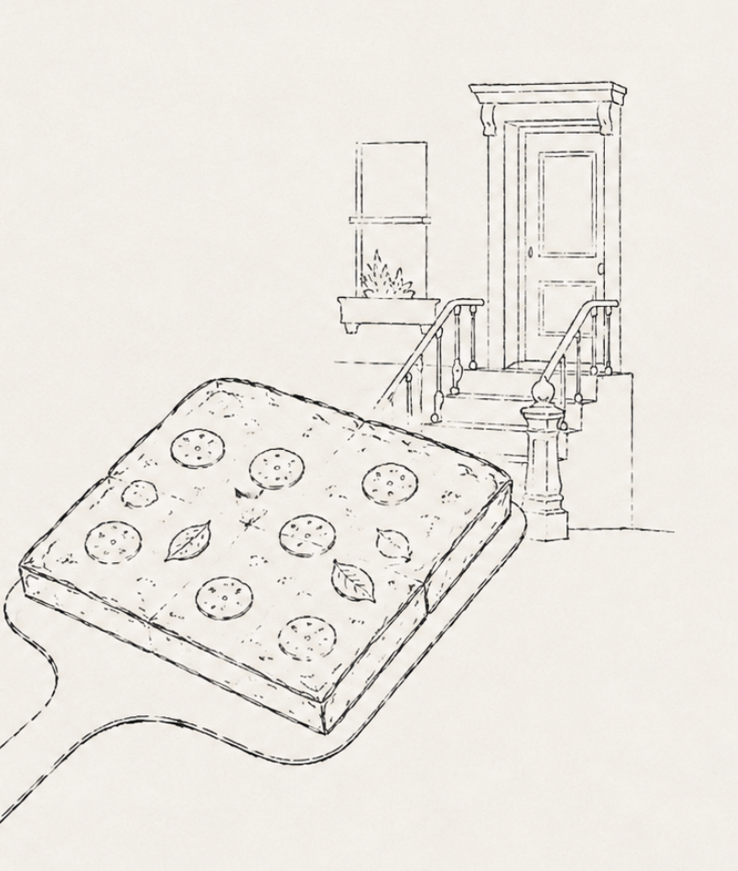 Square pizza on a peel in front of a Brooklyn brownstone